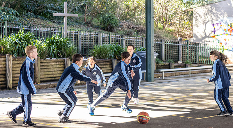 Our Lady of the Nativity Primary Lawson playing basketball in outdoor courts
