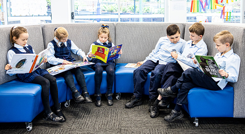 Our Lady of the Nativity Primary Lawson students reading together in the school library