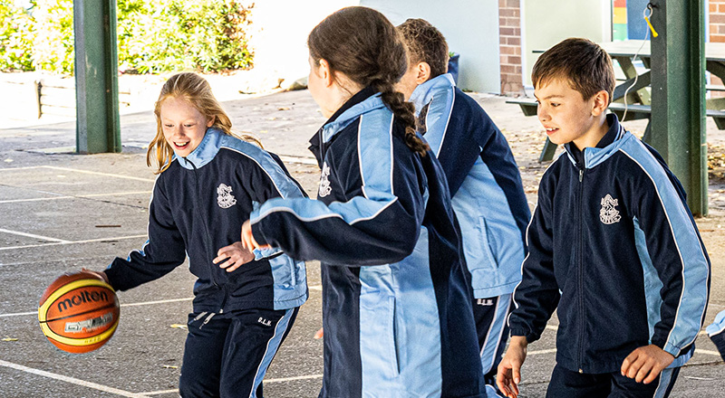 Our Lady of the Nativity Primary Lawson students playing basketball