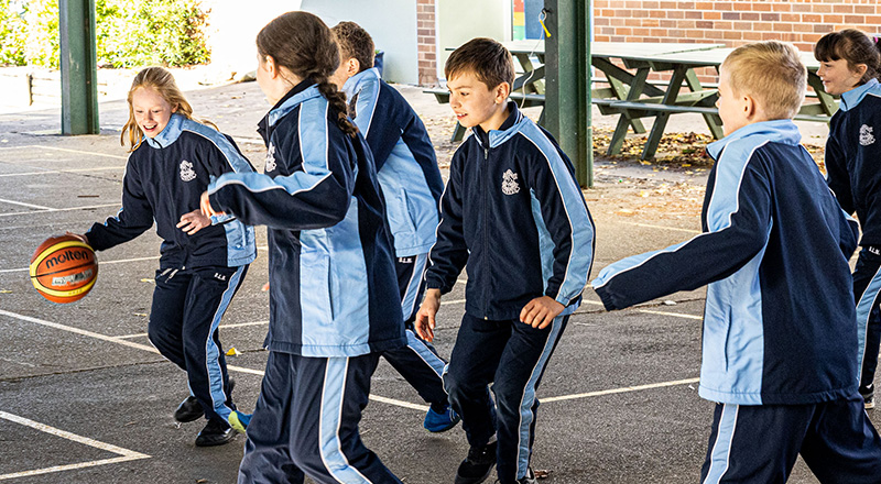 Our Lady of the Nativity Primary Lawson playing basketball in the shaded play space