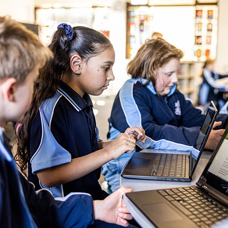Our Lady of the Nativity Primary Lawson students using Chromebook for learning