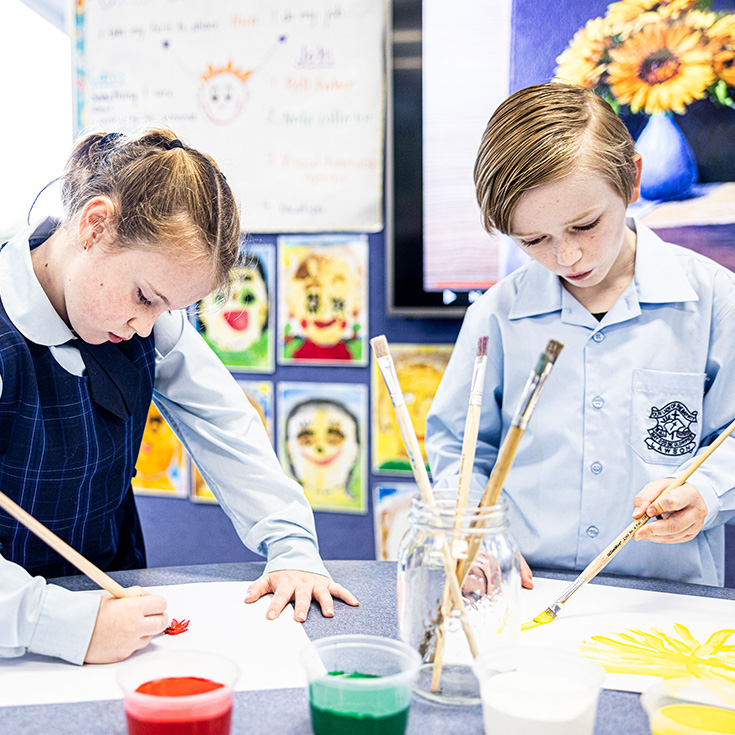 Boy and girl painting at Our Lady of the Nativity Catholic Primary Lawson