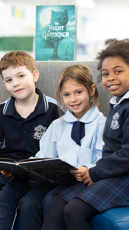 Three Our Lady of the Nativity Lawson school students in the library