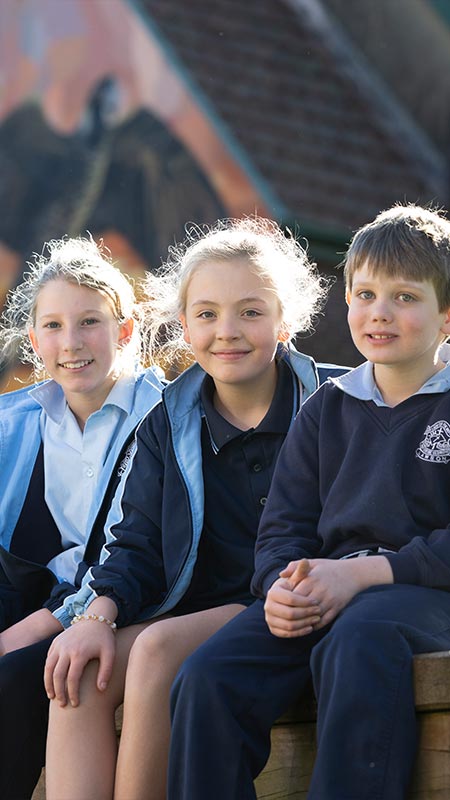 Three OLN Lawson students sitting outdoors