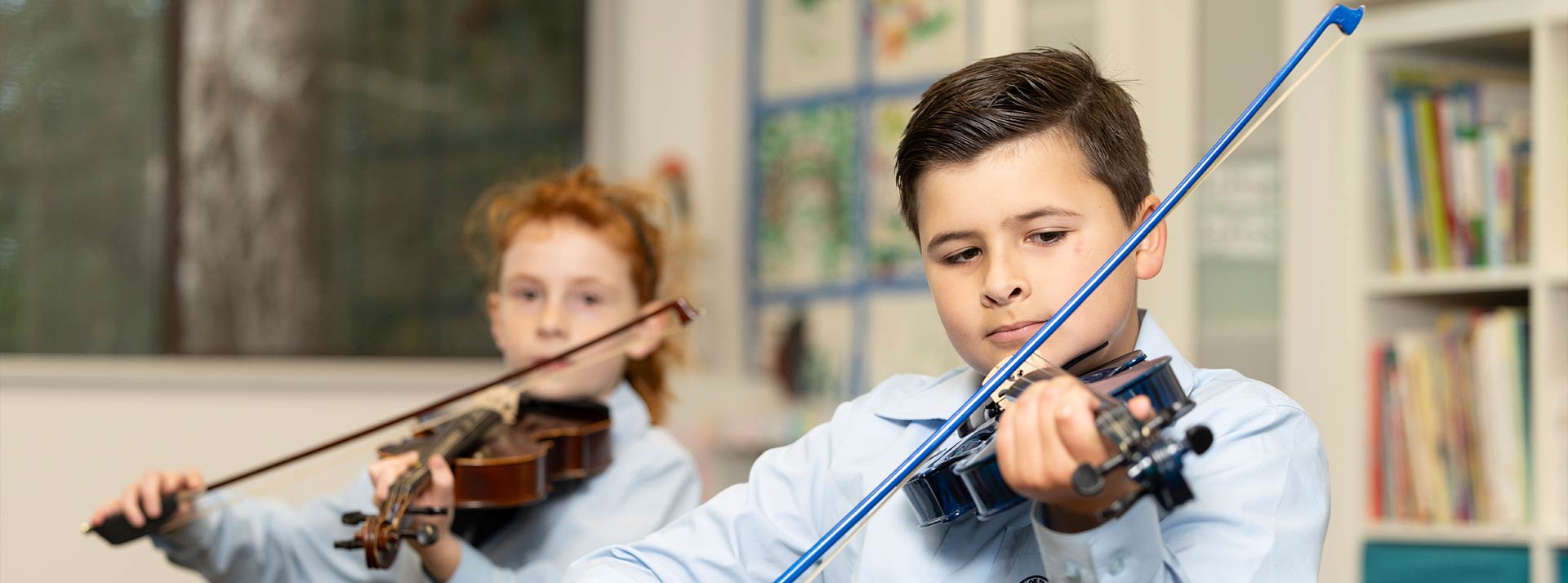 OLN Lawson Students playing string instrument