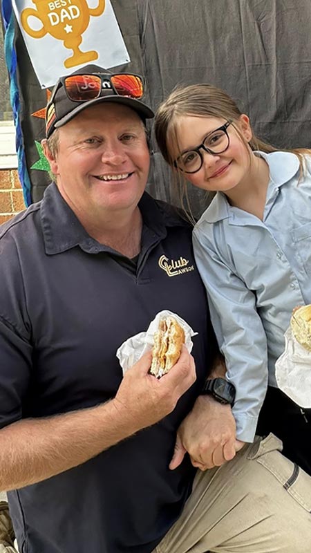 Dad and daughter at Our Lady of the Nativity Lawson