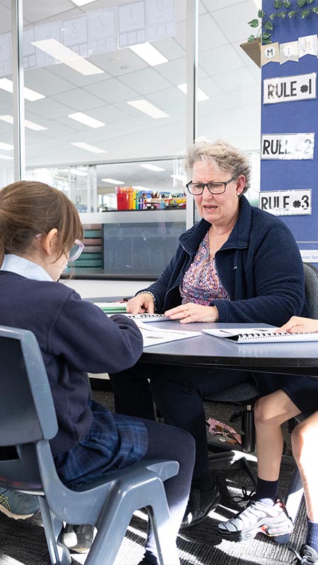 Our Lady of the Nativity Lawson Primary teacher assisting students