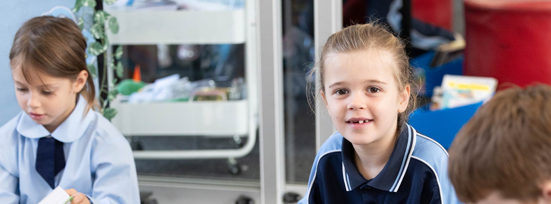 Our Lady of the Nativity Primary School Lawson student who is reading from a Children's Bible.