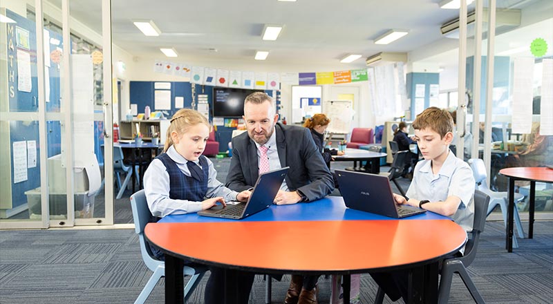 OLN Lawson Principal, Matthew Bond, assisting students in class.
