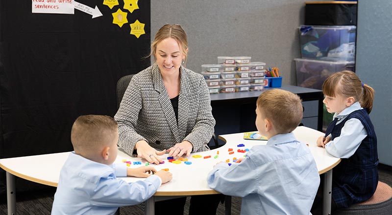 OLN Lawson Teacher assisting students with numeracy