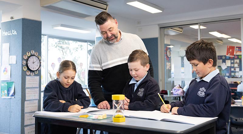 OLN Lawson Teacher assisting students in class