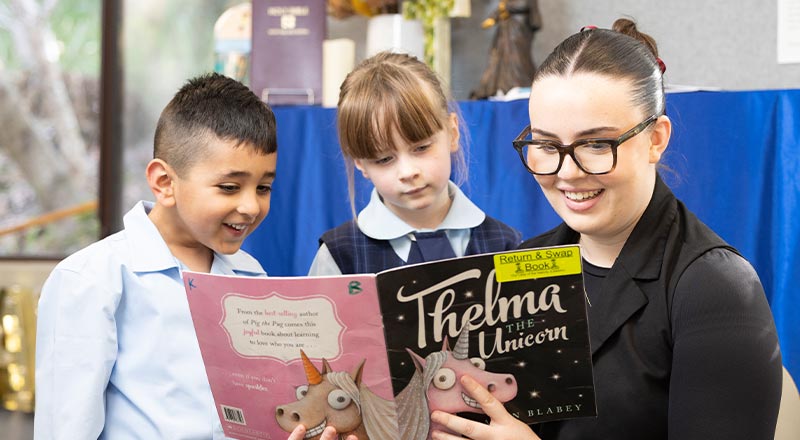 OLN Lawson Teacher reading to students