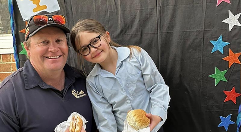 Dad and daughter at Our Lady of the Nativity Lawson
