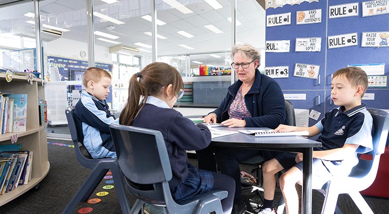 Our Lady of the Nativity Lawson Primary teacher assisting students