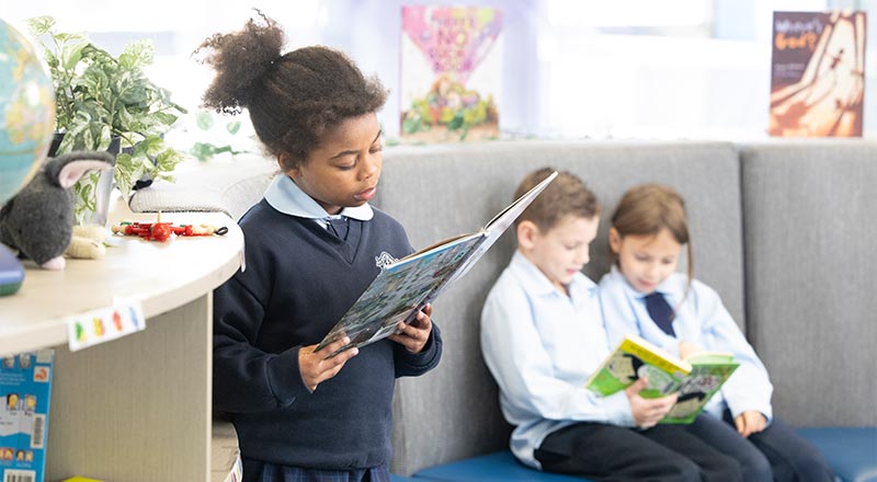 OLN Lawson students reading from library books