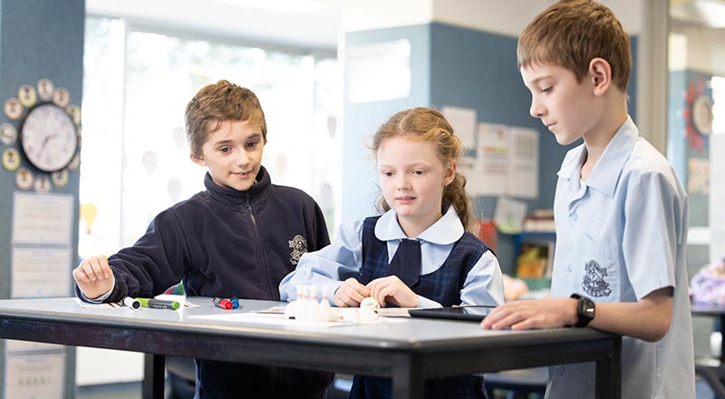 Our Lady of the Nativity Primary Lawson students reading together in the school library