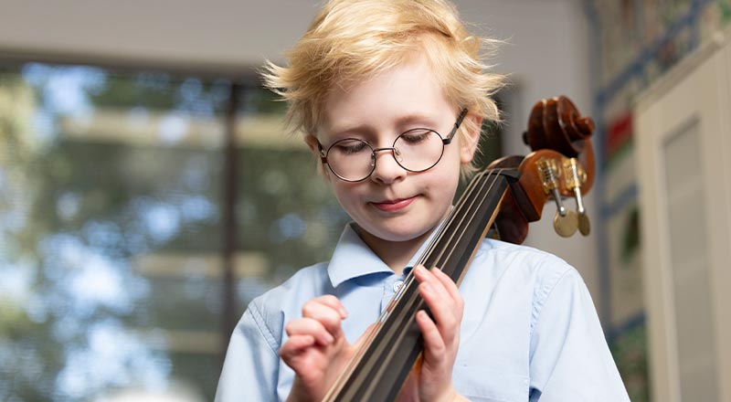 OLN Lawson student playing string instrument