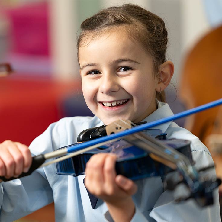 OLN Lawson Student playing stringed instrument