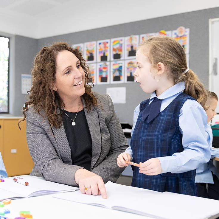 OLN Lawson Teacher assisting students in class