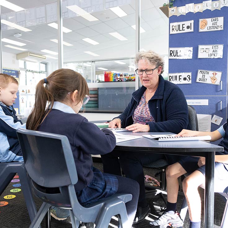 OLN Lawson Teacher assisting students in class