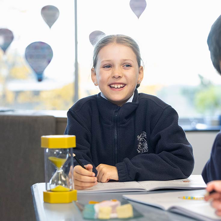 Happy OLN Lawson student in class