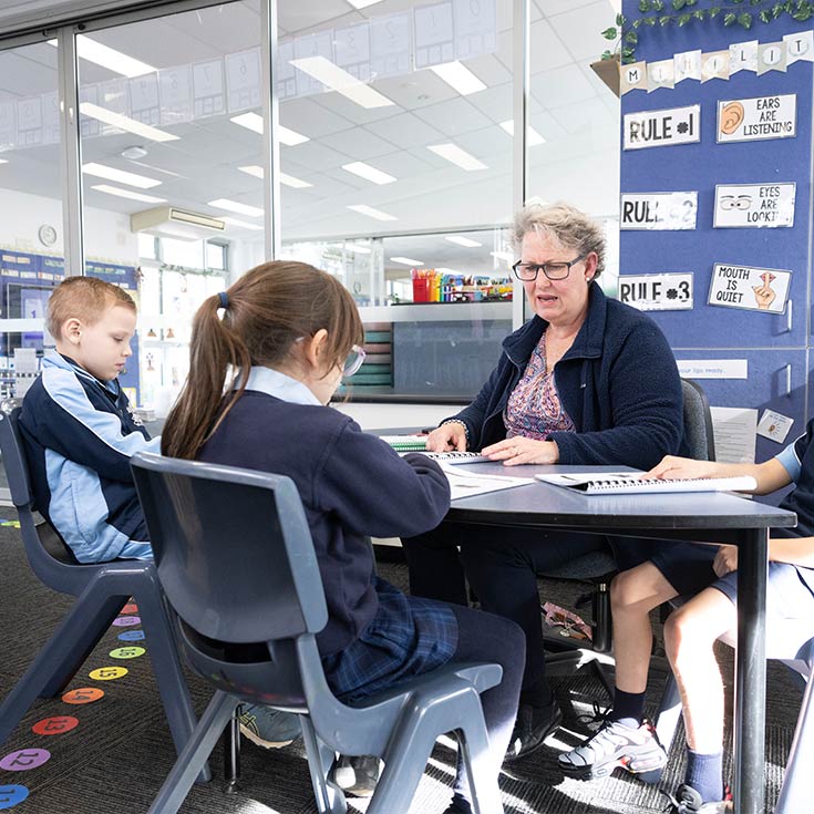 OLN Lawson teacher assisting students