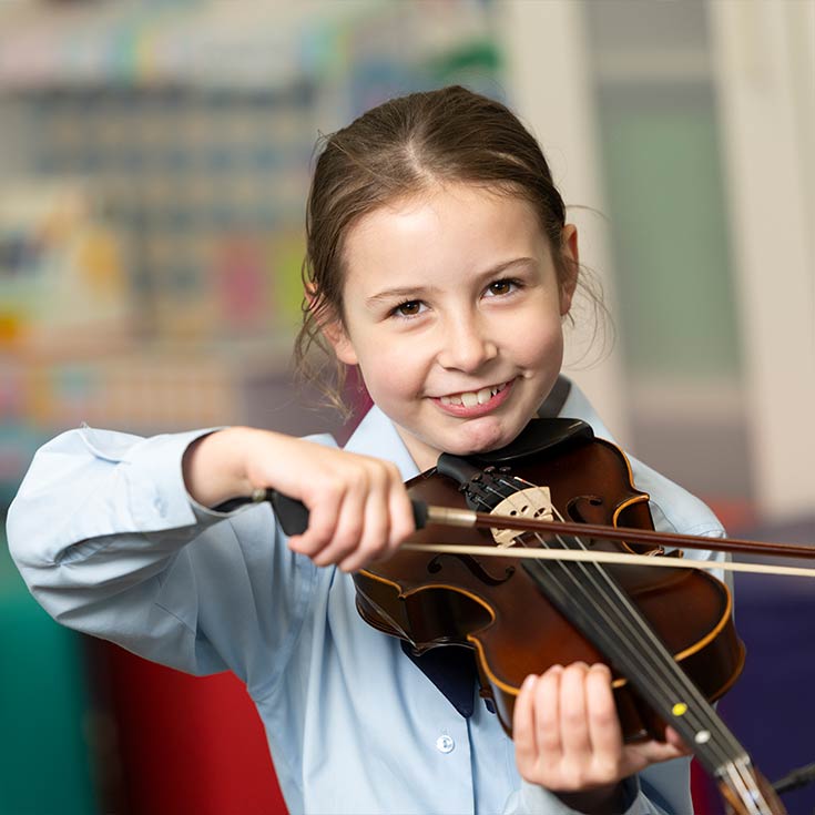 OLN Lawson student playing stringed instrument