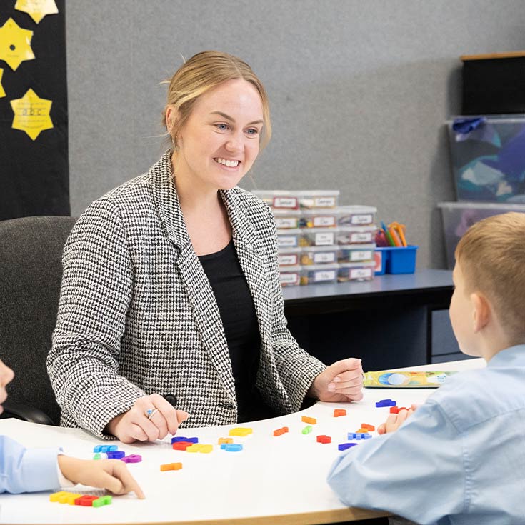 OLN Lawson Teacher assisitng students with numeracy