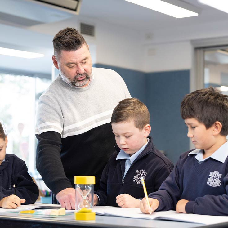 OLN Lawson teacher assisting students